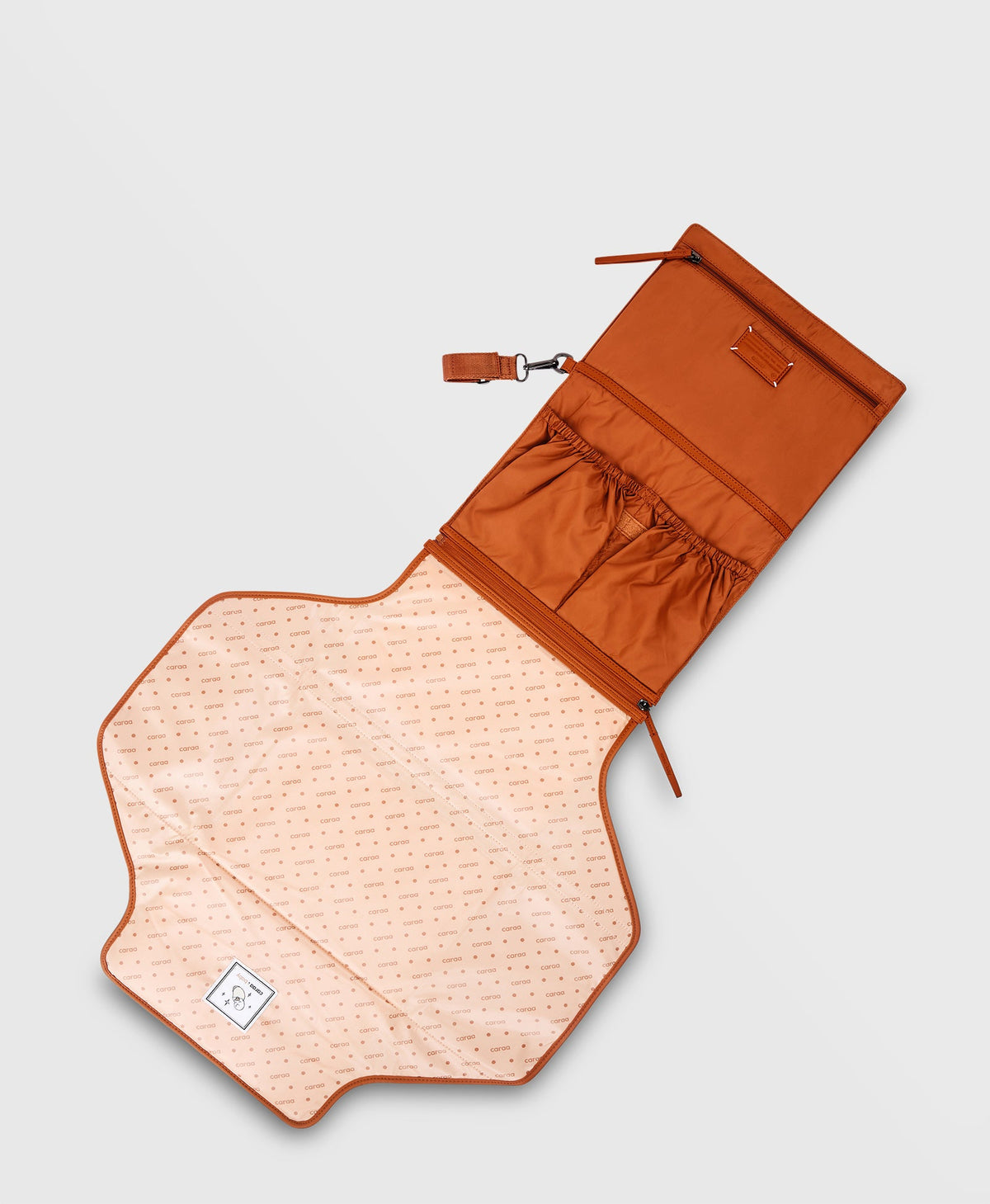 Caraa Baby Changing Kit in Clay, unfolded into a changing pad