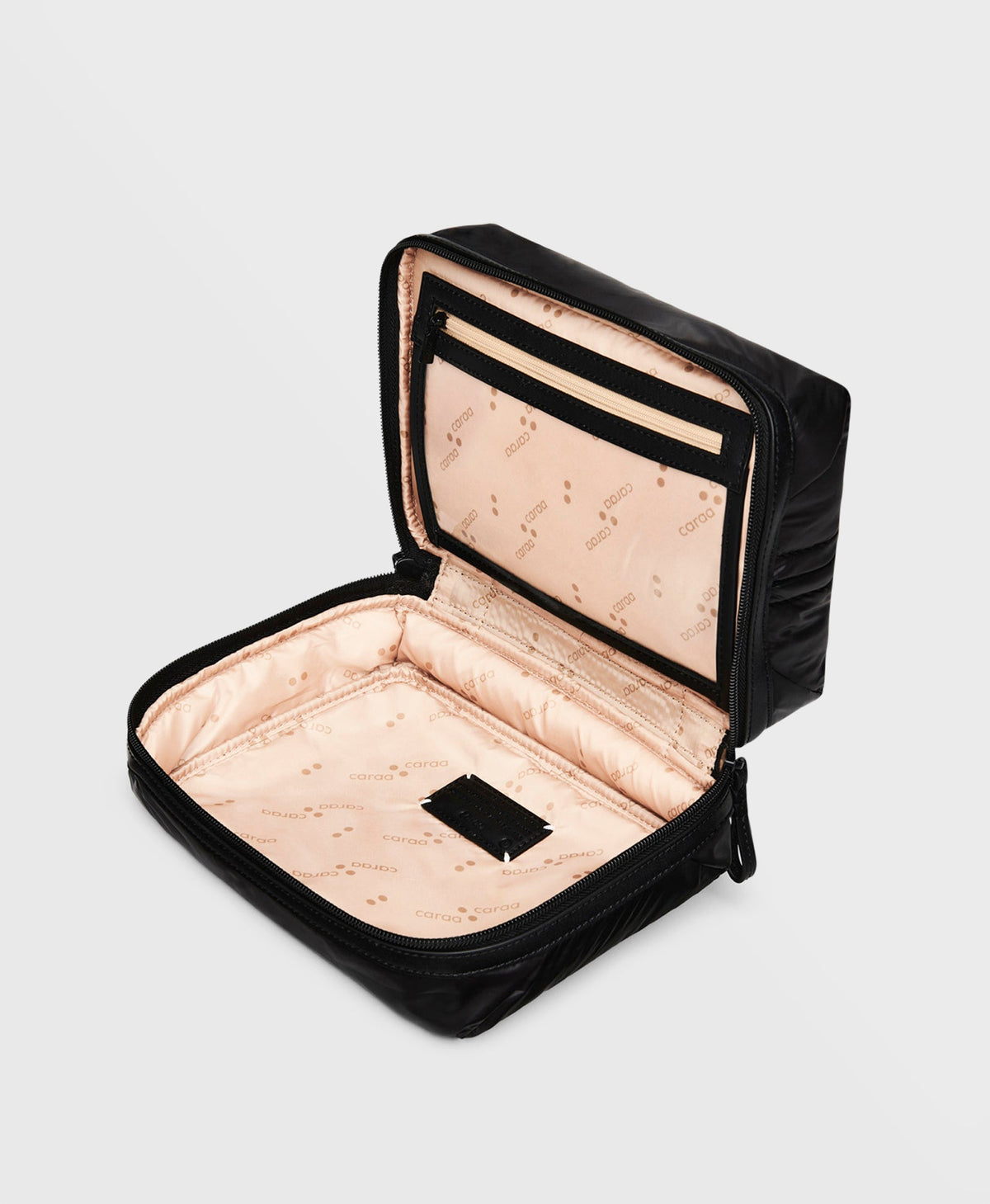 Caraa Travel Kit in Black, open to show the lining and jewelry pocket