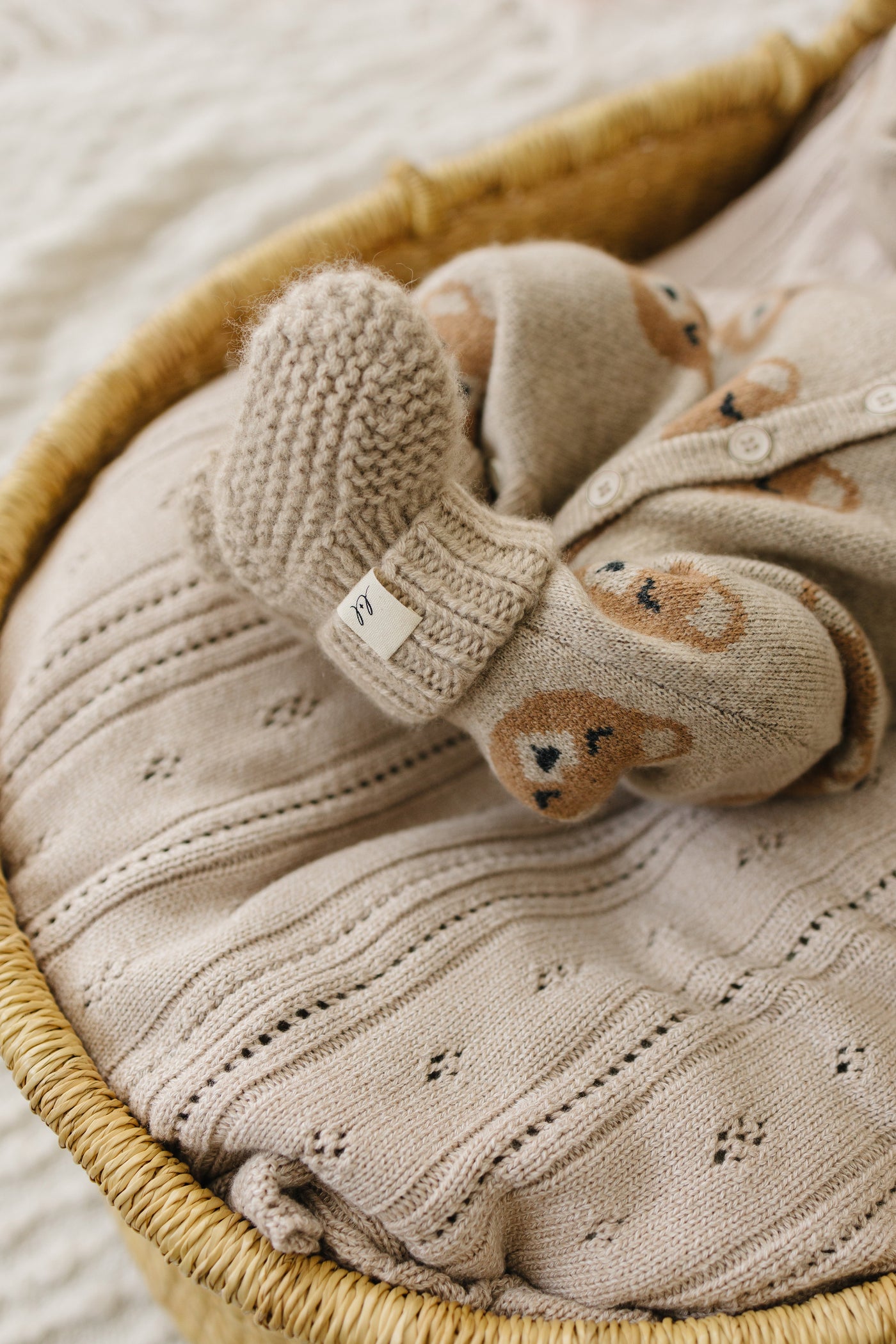 The booties and bonnet in heathered brown cashmere