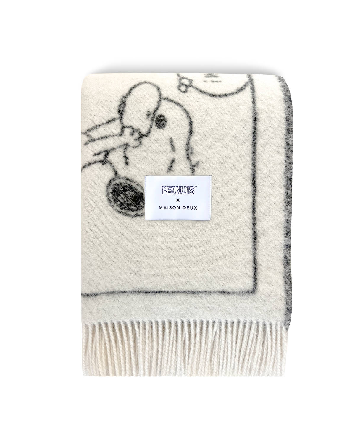 Maison Deux Peanuts comic strip wool blanket in white and black, folded