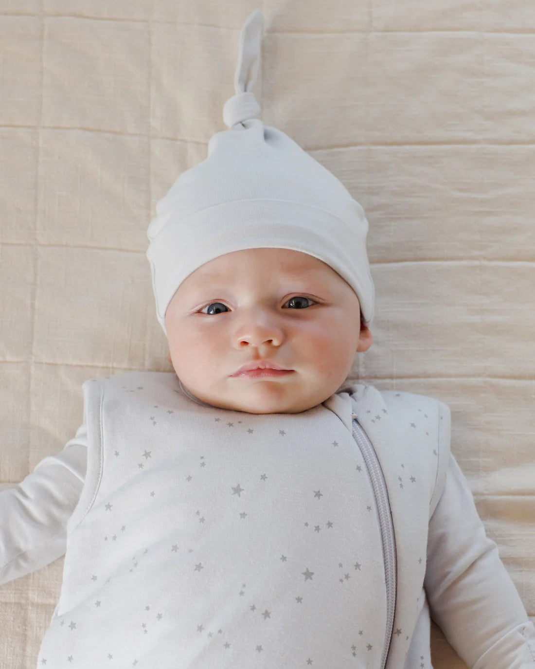 The First Sleep, the knotted gown, hat and swaddle for the first nights at home