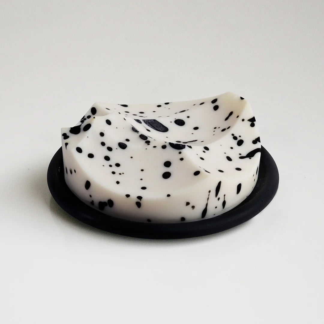 The sculptural bar, cream with black flecks