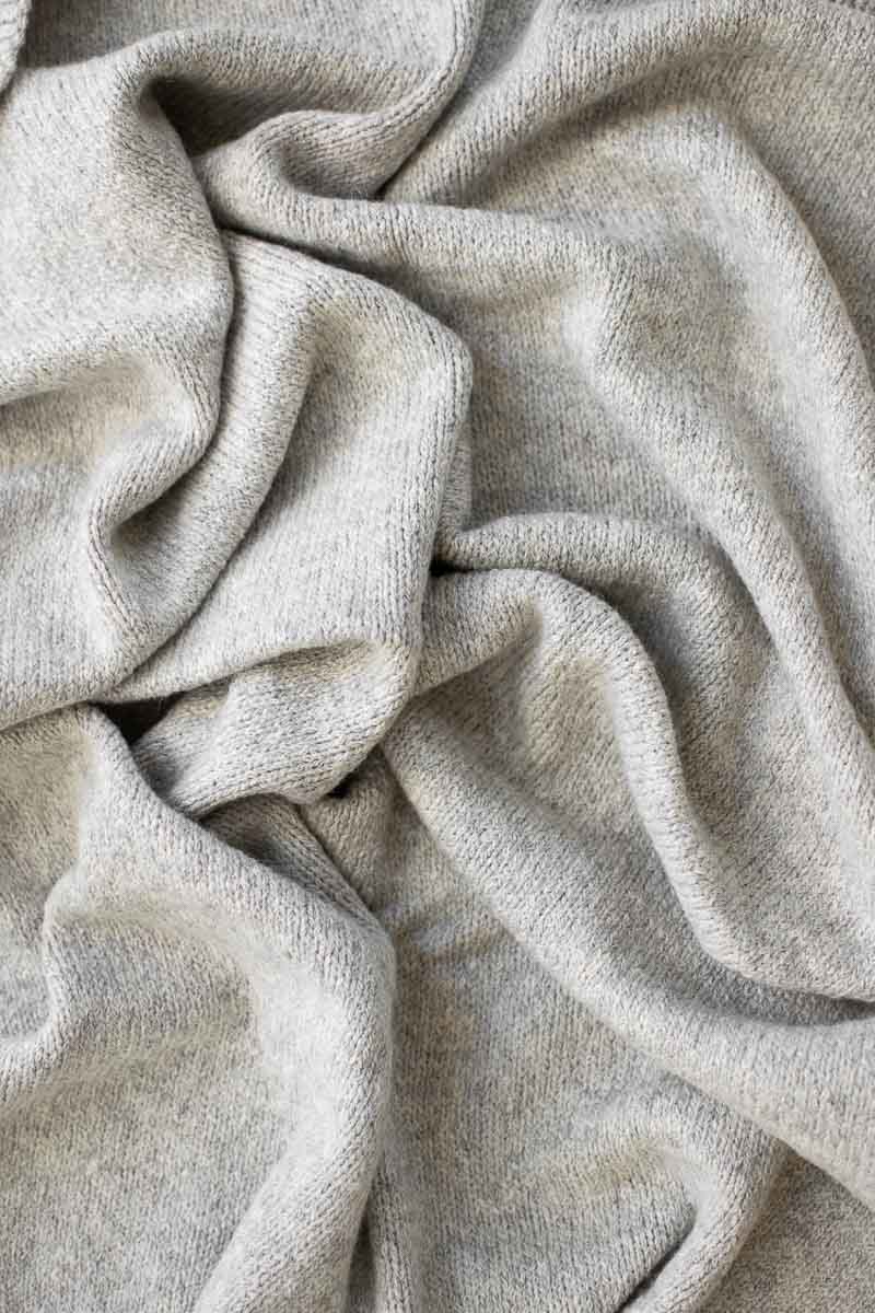 Fair + Simple alpaca and organic pima baby blanket in grey, draped