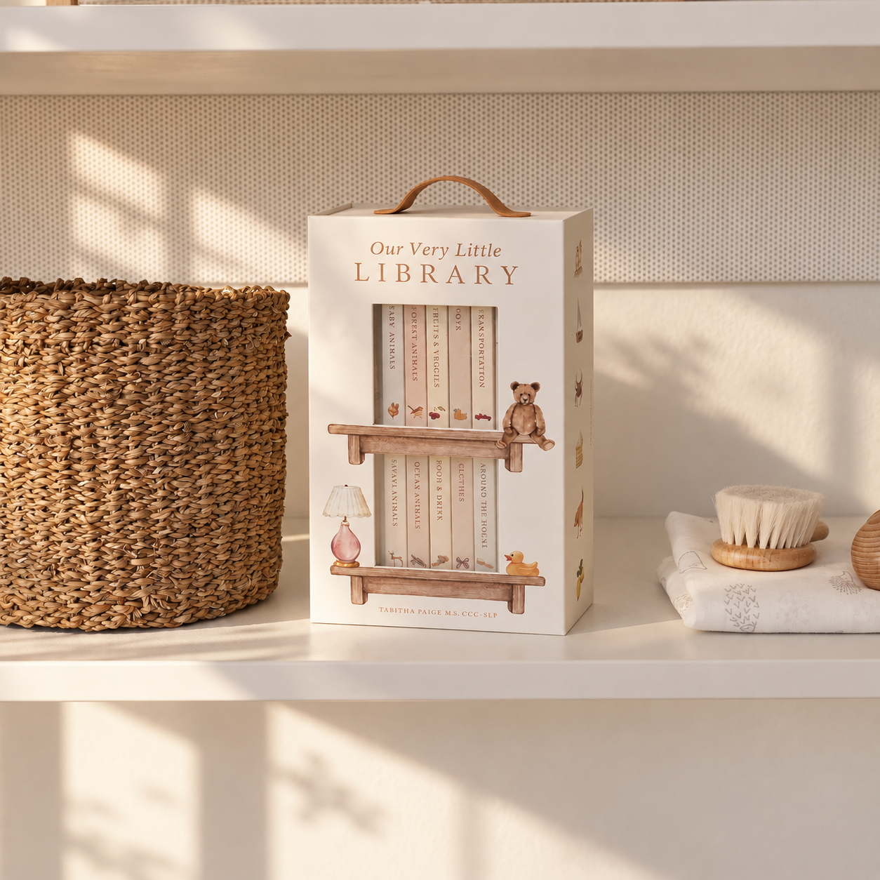 The Welcome, composed with the board book set, organic burp cloths, undyed booties, teether and candle