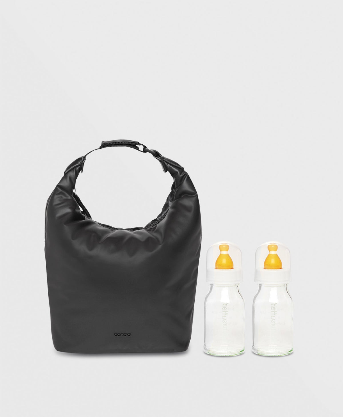 Caraa Baby Bottle Bag in Black beside two bottles
