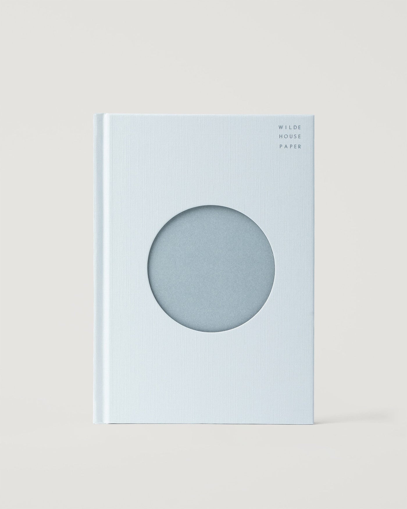 Open Journal in Cloud, linen board hardcover with a debossed circle on the front