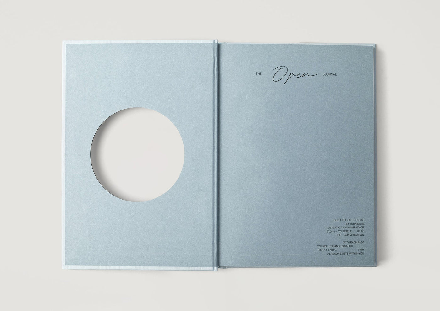 The cutout circle on the cover, shown open