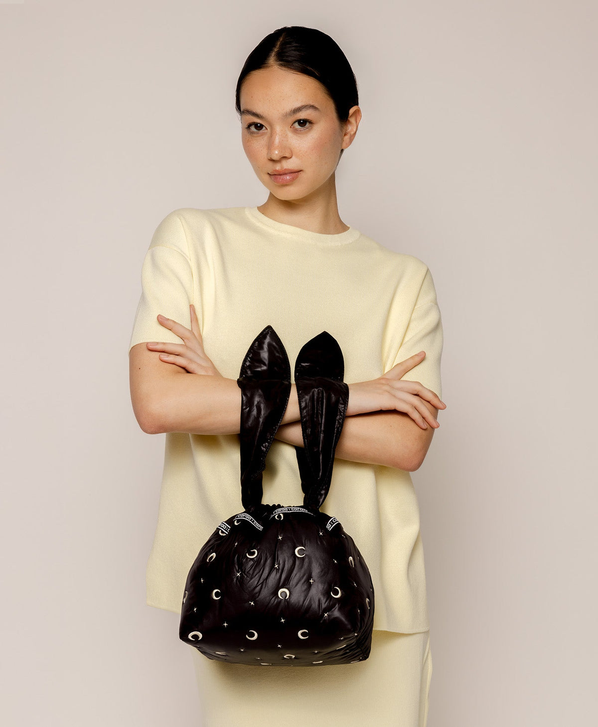 Caraa Lunch Pouch in Black Moon and Star carried by its ties
