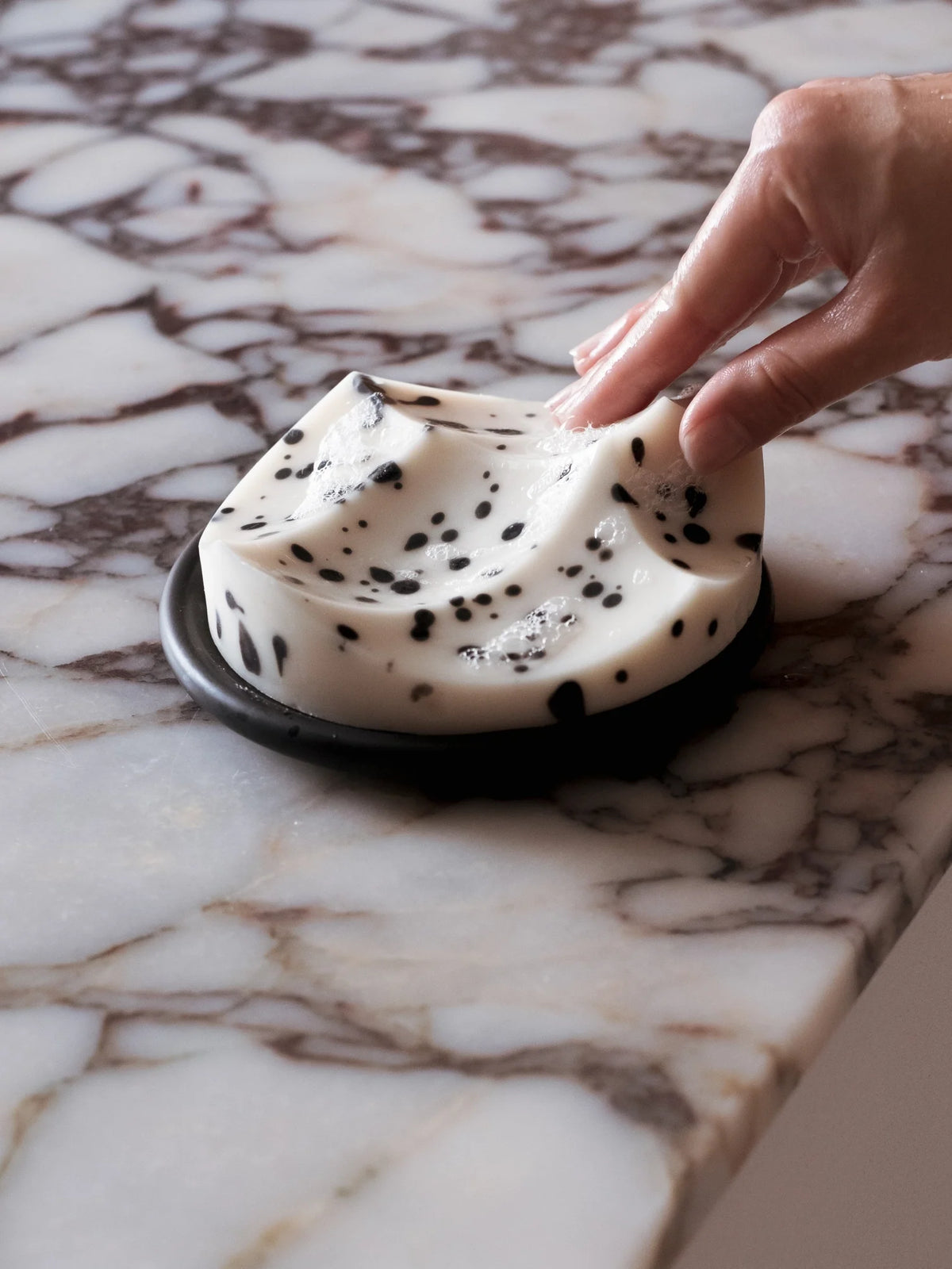 Erode Soap in White Grapefruit, lathered by hand on marble