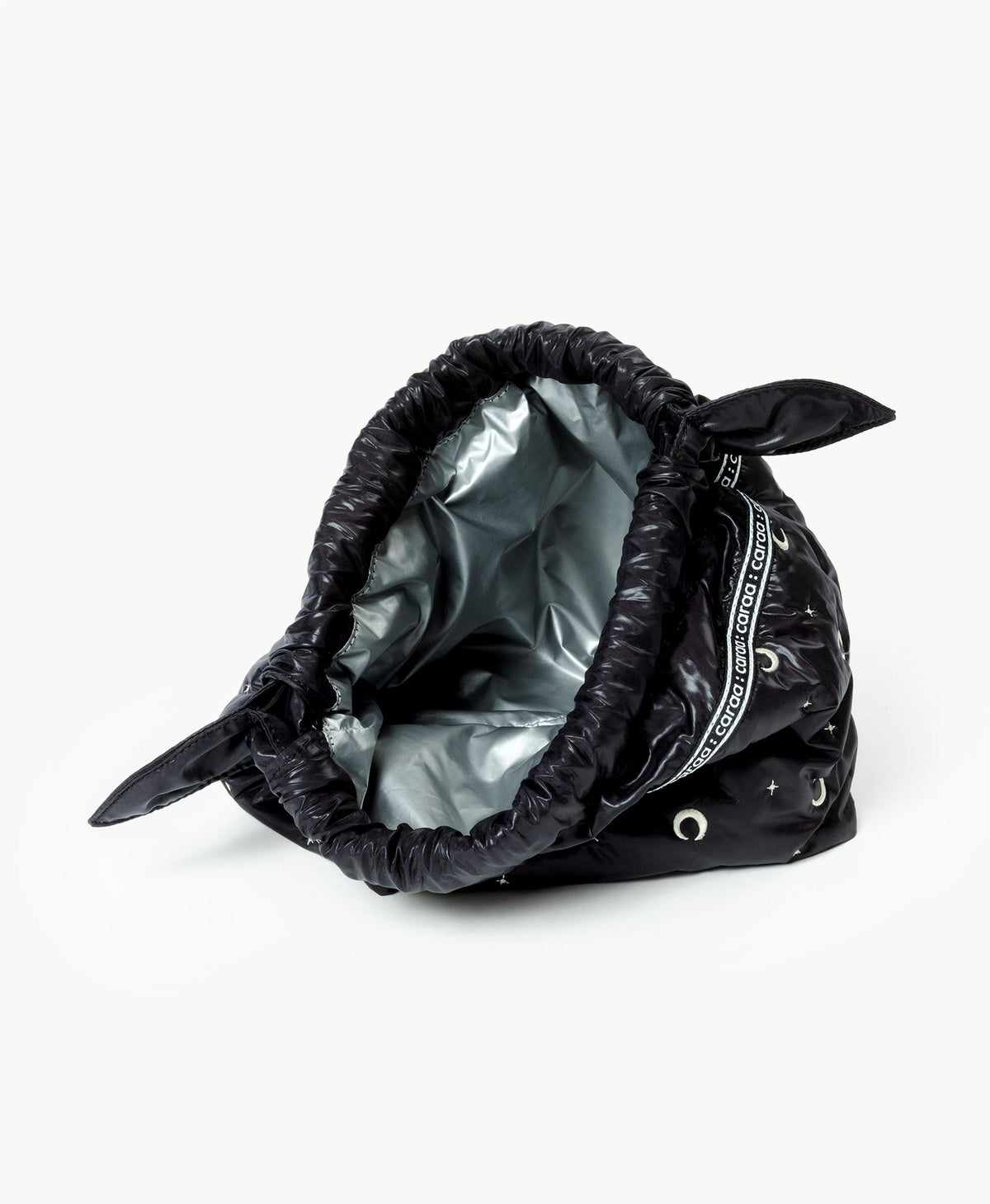 Caraa Lunch Pouch in Black Moon and Star, open to show the insulated lining