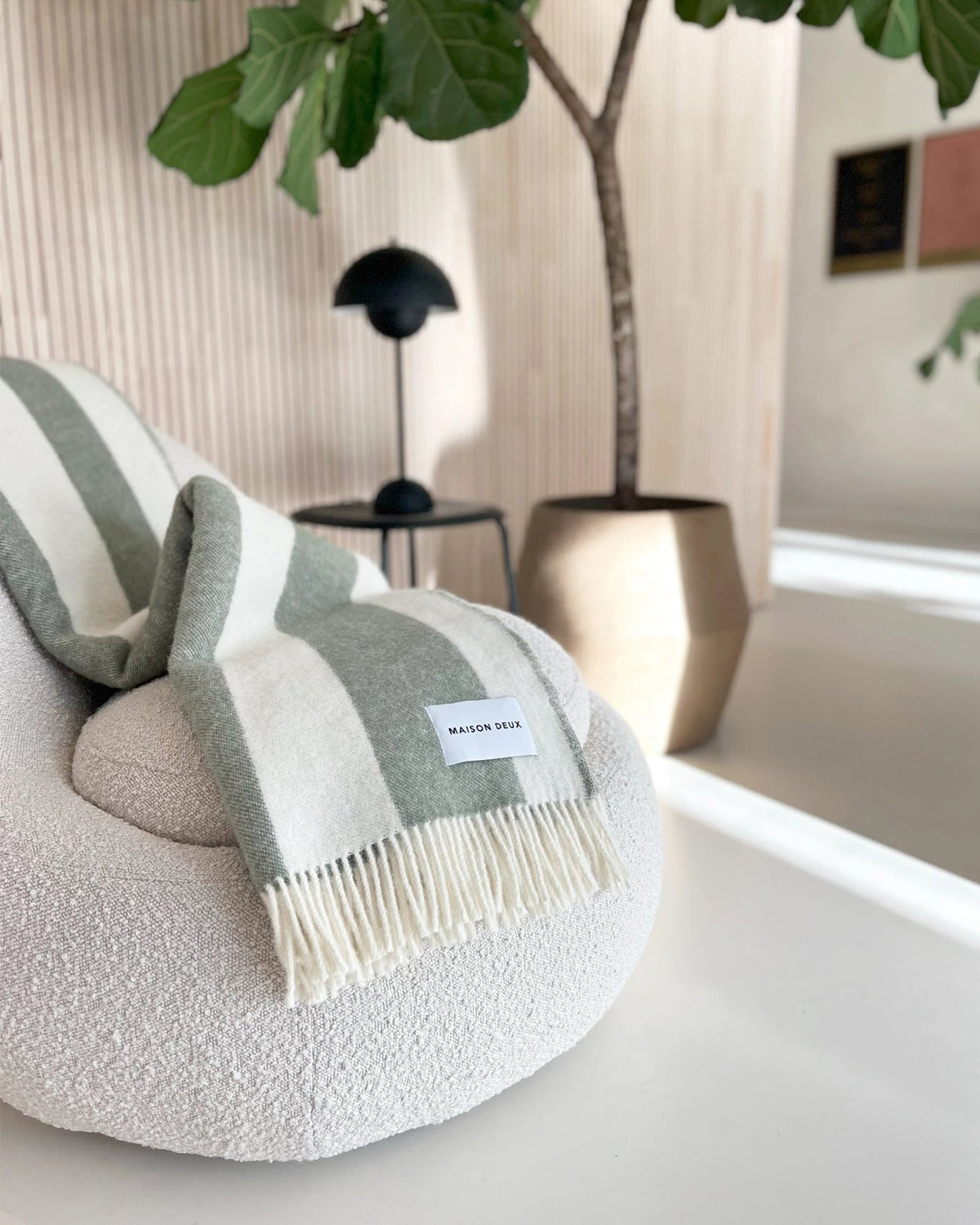 Maison Deux Rough Stripe Blanket in Agave, on the chair