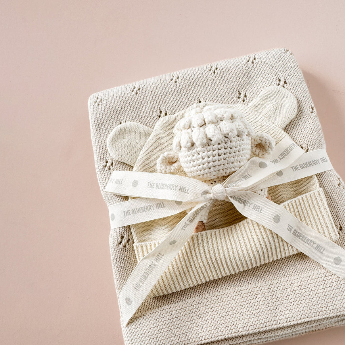 Pique blanket, hat and lamb teether, detail